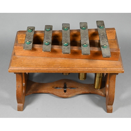 941 - An Edwardian oak-framed xylophone dinner-gong with five brass keys above tubular bells, on lyre supp... 