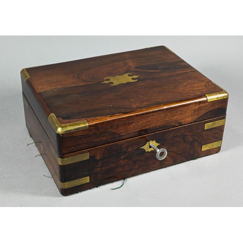944 - A 19th century brass-bound rosewood toilet case, the fitted interior with bottles, jars and silver-h... 