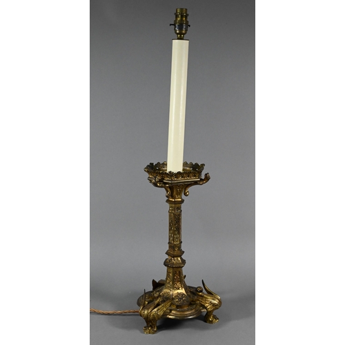 945 - A Victorian Gothic Revival gilt bronze torchère with galleried top supported by mythical beast, on h... 