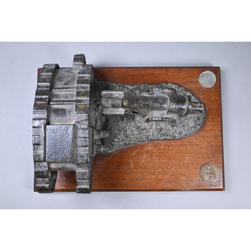 946 - A cast iron novelty mechanical money-box cast with WW1 tank and cannon, on teak base, 10 x 24.5 x 10... 