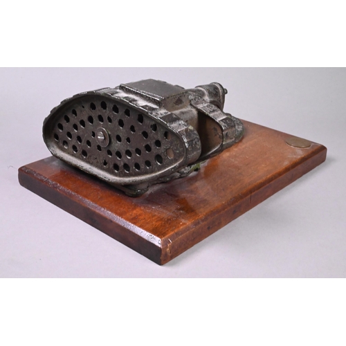 946 - A cast iron novelty mechanical money-box cast with WW1 tank and cannon, on teak base, 10 x 24.5 x 10... 