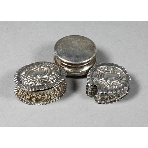 95 - Two embossed silver pill-boxes, Birmingham 1899/1902 to/w an ep plain pill-box (3)