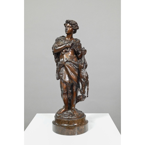 952 - Emile Boyer (1877 - 1948), brown-patinated bronze huntsman in wolf-skin cloak, holding a deer, on tu... 