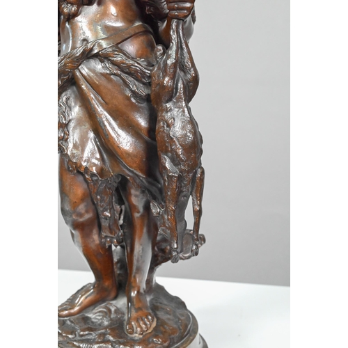 952 - Emile Boyer (1877 - 1948), brown-patinated bronze huntsman in wolf-skin cloak, holding a deer, on tu... 