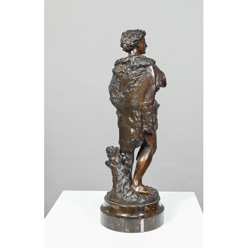 952 - Emile Boyer (1877 - 1948), brown-patinated bronze huntsman in wolf-skin cloak, holding a deer, on tu... 