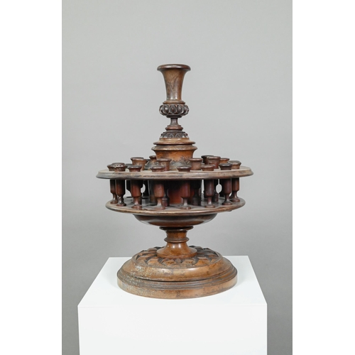 955 - An antique carved and turned wood snuff or tobacco stand with sectional central pillar surrounded by... 