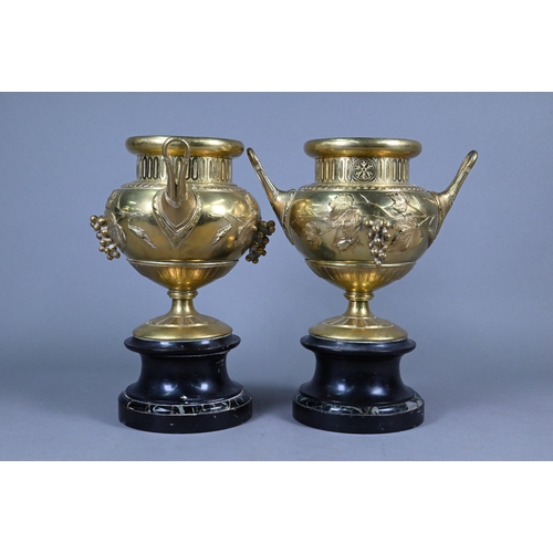 957 - Pair of 19th century French brass garniture urns with relief vine and insects decoration, 30 cm high