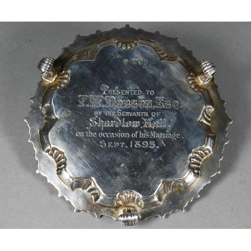 96 - A late Victorian silver card salver in the Georgian manner, with shell and gadroon-moulded rim, on t... 