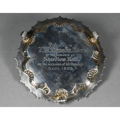 96 - A late Victorian silver card salver in the Georgian manner, with shell and gadroon-moulded rim, on t... 