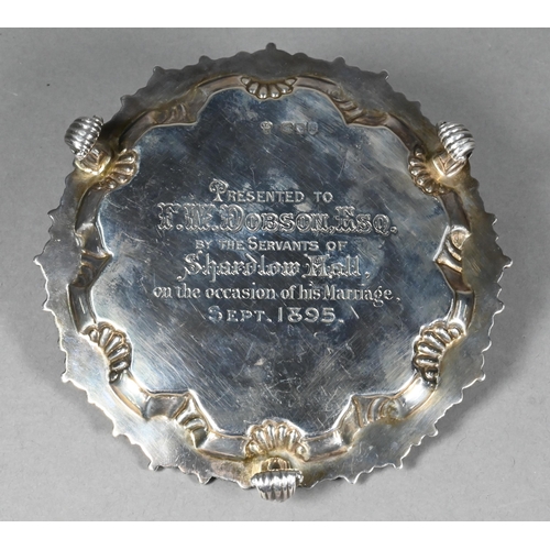 96 - A late Victorian silver card salver in the Georgian manner, with shell and gadroon-moulded rim, on t... 