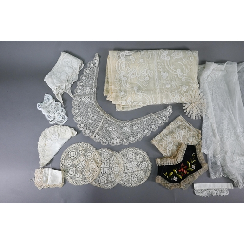 965 - A fine ivory lace wedding veil, richly worked with floral designs and scrolls, 190 x 105 cm max (bel... 