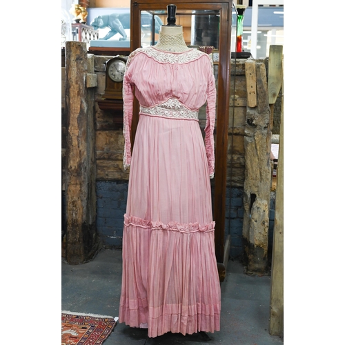 967 - An Edwardian pink silk, lace and crochet dress, 150 cm from collar to hem