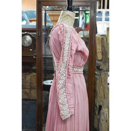 967 - An Edwardian pink silk, lace and crochet dress, 150 cm from collar to hem