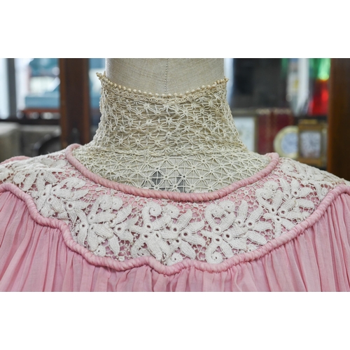 967 - An Edwardian pink silk, lace and crochet dress, 150 cm from collar to hem