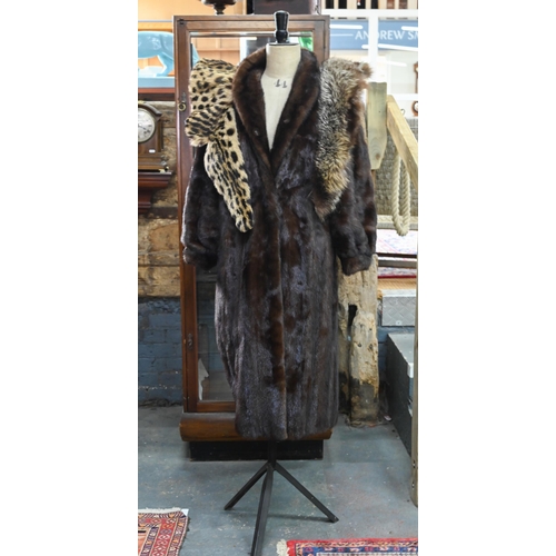 970 - A vintage leopard-skin stole with black satin lining, to/w a calf-length mink coat with fitted cuffs... 