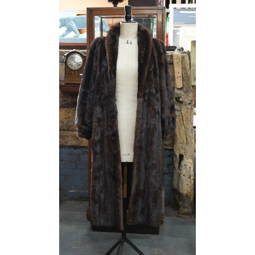 970 - A vintage leopard-skin stole with black satin lining, to/w a calf-length mink coat with fitted cuffs... 