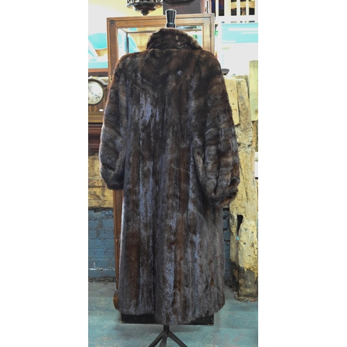 970 - A vintage leopard-skin stole with black satin lining, to/w a calf-length mink coat with fitted cuffs... 