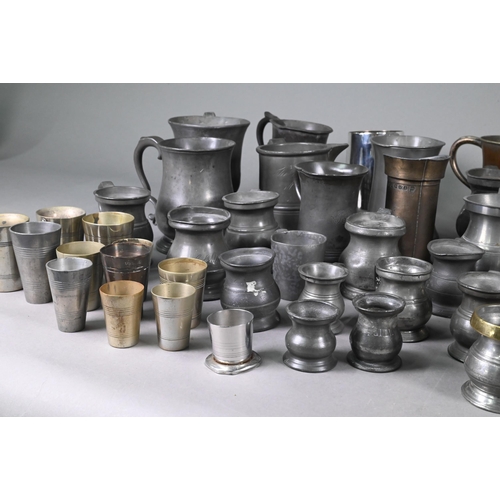 975 - A collection of over fifty Victorian and later pewter and other base-metal measures with government ... 