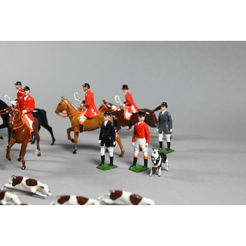 980 - A Britain's die-cast fox-hunt set, with eight mounted figures and five figures on foot, sixteen houn... 