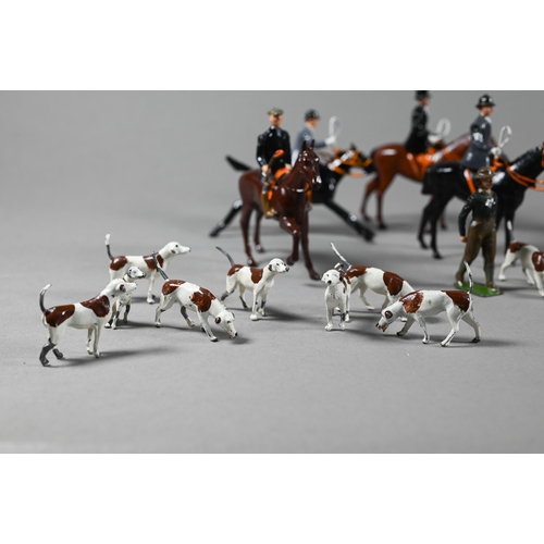 980 - A Britain's die-cast fox-hunt set, with eight mounted figures and five figures on foot, sixteen houn... 