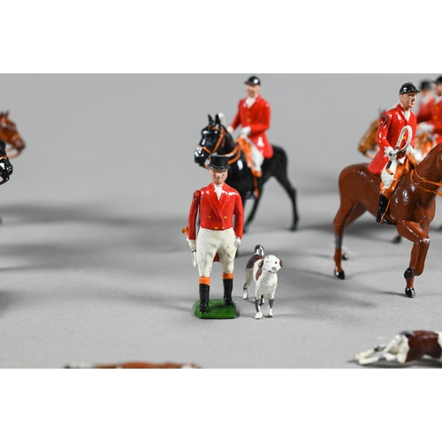 980 - A Britain's die-cast fox-hunt set, with eight mounted figures and five figures on foot, sixteen houn... 