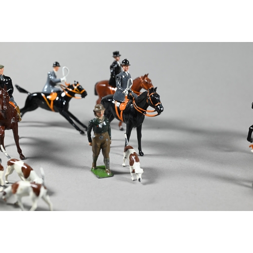 980 - A Britain's die-cast fox-hunt set, with eight mounted figures and five figures on foot, sixteen houn... 