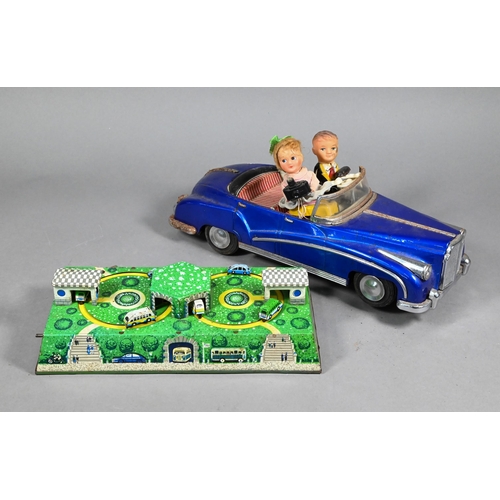 981 - A Chinese tinplate 'Photoing in Car' model - blue Bentley, with automaton driver, the passenger with... 