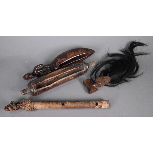 996 - A collection of African tribal wood carvings and other artefacts, including figural spoons, instrume... 