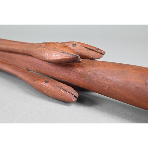998 - A Papua New Guinea tribal carved wood shield, worked with a mask with prominent nose below a bird, 7... 