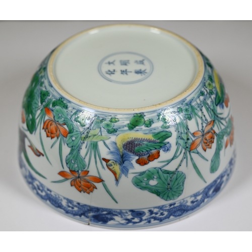 320 - A Chinese 18th century doucai 'duck and lotus' marriage bowl, finely painted in polychrome enamels w... 