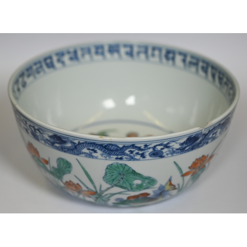 320 - A Chinese 18th century doucai 'duck and lotus' marriage bowl, finely painted in polychrome enamels w... 