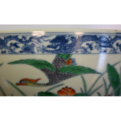 320 - A Chinese 18th century doucai 'duck and lotus' marriage bowl, finely painted in polychrome enamels w... 