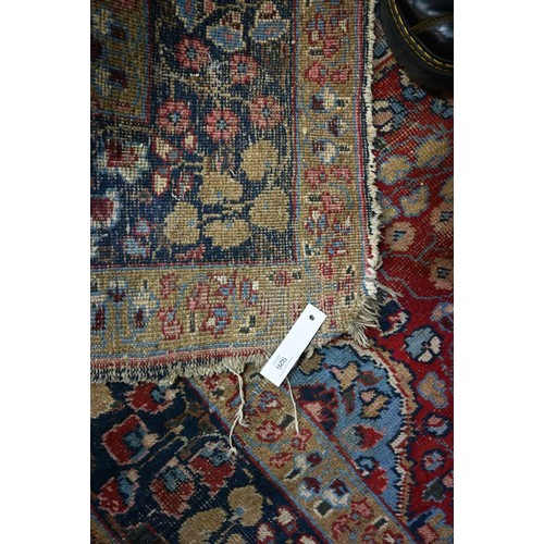925 - An old Indian floral design carpet, worn and a/f 320 x 214 cm