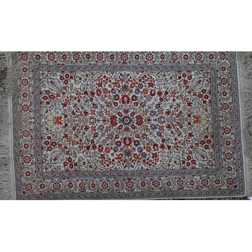 903 - A fine Turkish Hereke silk rug, the yellow/ochre ground centred by a floral medallion, 150 cm x 102 ... 