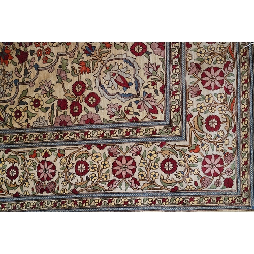 903 - A fine Turkish Hereke silk rug, the yellow/ochre ground centred by a floral medallion, 150 cm x 102 ... 