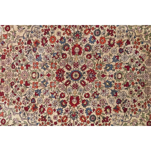 903 - A fine Turkish Hereke silk rug, the yellow/ochre ground centred by a floral medallion, 150 cm x 102 ... 