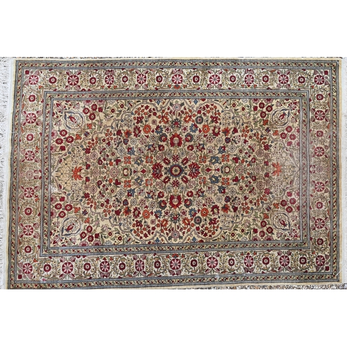 903 - A fine Turkish Hereke silk rug, the yellow/ochre ground centred by a floral medallion, 150 cm x 102 ... 