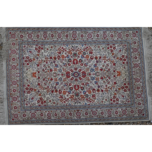 903 - A fine Turkish Hereke silk rug, the yellow/ochre ground centred by a floral medallion, 150 cm x 102 ... 