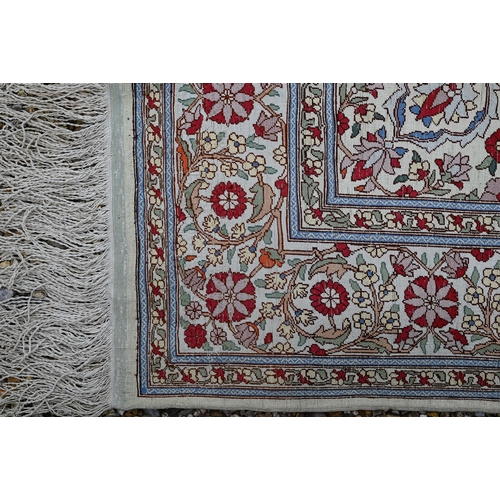 903 - A fine Turkish Hereke silk rug, the yellow/ochre ground centred by a floral medallion, 150 cm x 102 ... 
