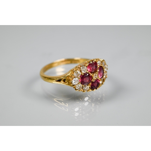 253 - An antique garnet and diamond cluster ring formed of four circular garnets with eleven diamonds arou... 