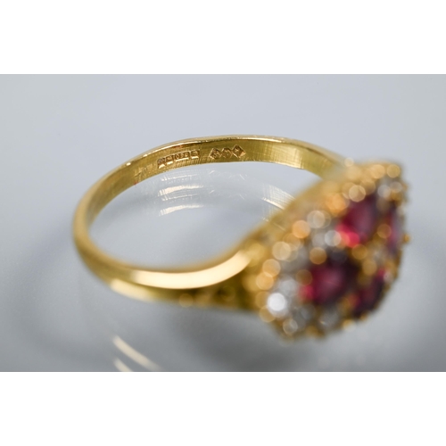 253 - An antique garnet and diamond cluster ring formed of four circular garnets with eleven diamonds arou... 