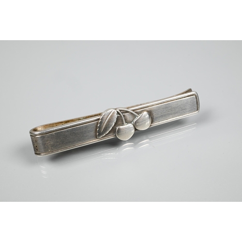 268 - Georg Jensen - 'Cherry Heering' - a white metal tie clip featuring a pair of cherries, marked for Je... 