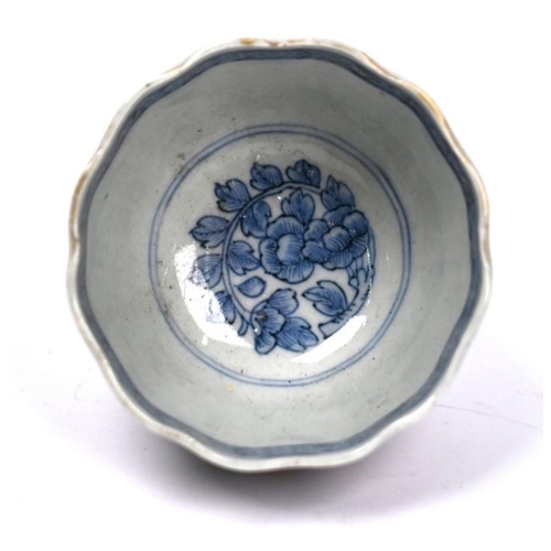 299 - A 19th century Japanese Arita floriform tea bowl, painted in underglaze blue and polychrome Imari pa... 