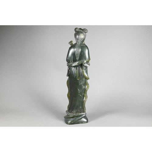 301 - A 20th century Chinese carved green soapstone figure of a courtesan wearing traditional robes with f... 