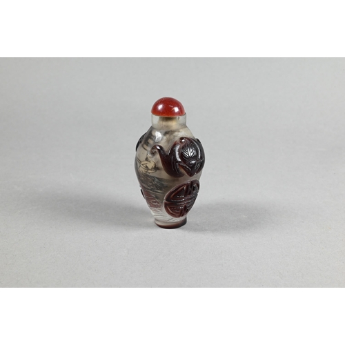 356 - A Chinese Peking cameo glass ovoid snuff bottle with red stopper, the clear glass bottle inside pain... 