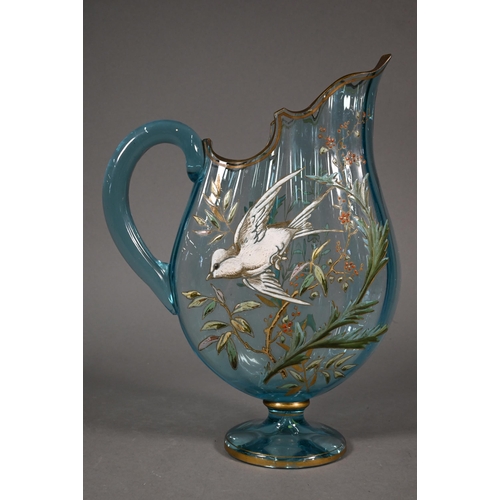 477 - A Continental blue glass jug of flattened form, painted with a bird in flight amongst foliage, 29 cm... 