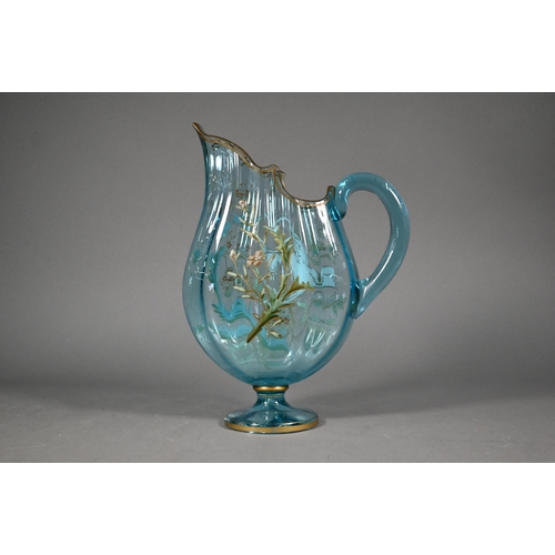 477 - A Continental blue glass jug of flattened form, painted with a bird in flight amongst foliage, 29 cm... 