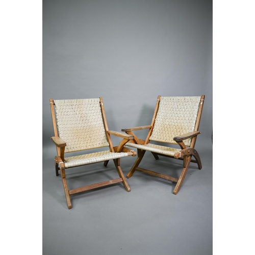 752 - A pair of Danish style hardwood and cane chairs, probably of African origin (2)