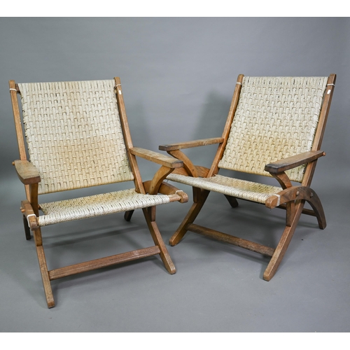 752 - A pair of Danish style hardwood and cane chairs, probably of African origin (2)