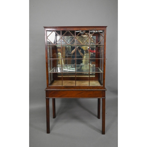 756 - A Georgian Chippendale style glazed mahogany display cabinet, raised on a converted mahogany card ta... 